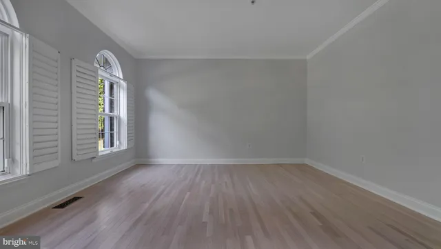 a spacious bathroom with a bathtub and toilet