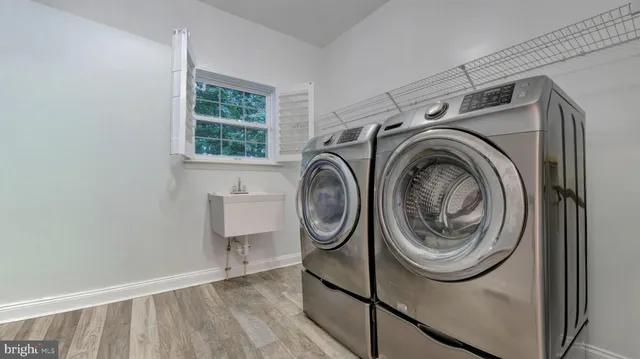 a view of a house with a wooden deck