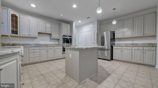 a view of cabinets and wooden floor