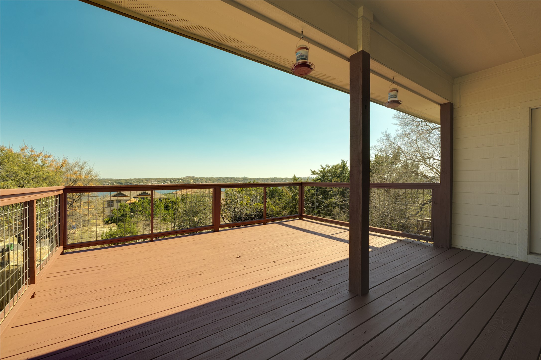 330 Southwind Road Point Venture, TX 78645 - Photo 12 of 39 Front-row seats to Lake Travis and those hill-country horizons, this deck is the whole point.