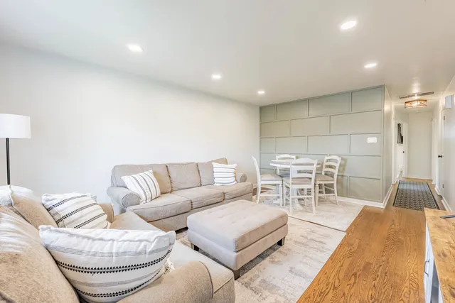 a living room with furniture and a table