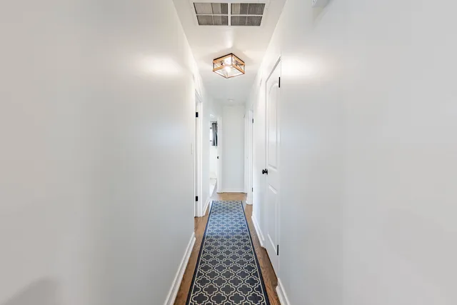 a view of hallway with mirror