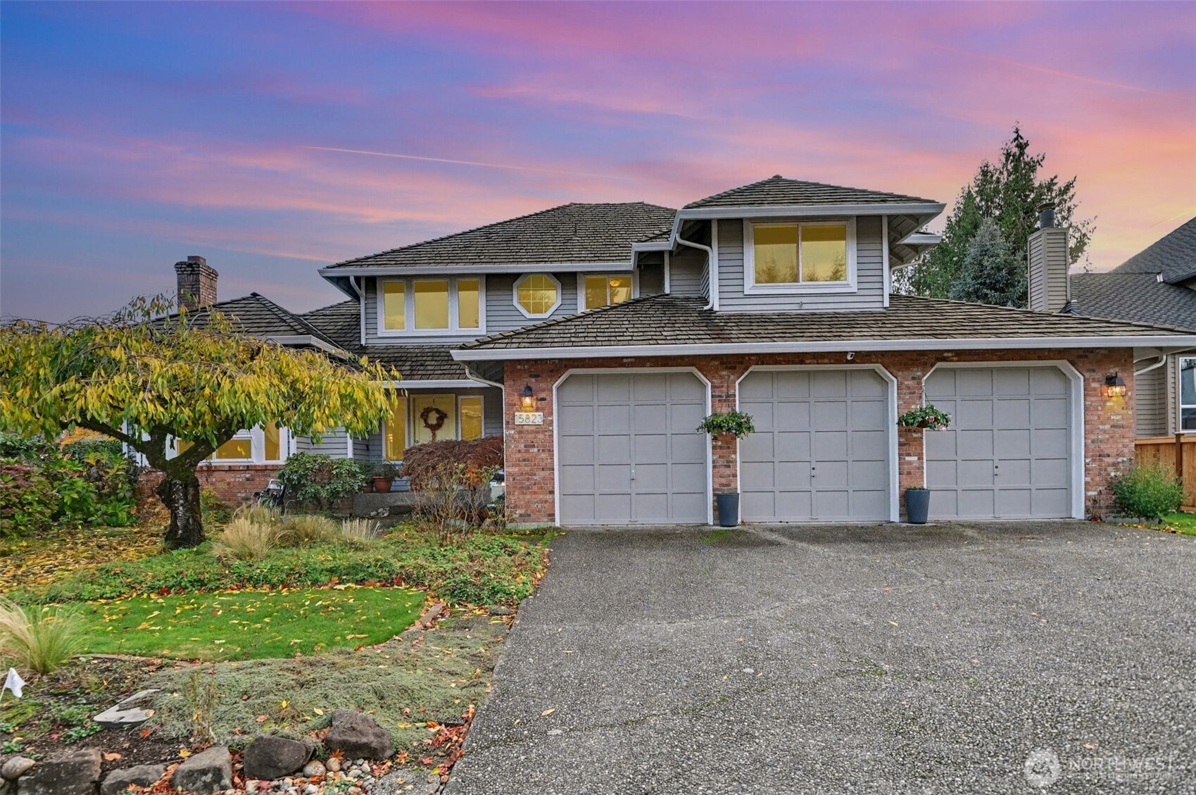15823 Southeast 182nd Place Renton, WA 98058 - Photo 1 of 30 a front view of a house with a yard and garage