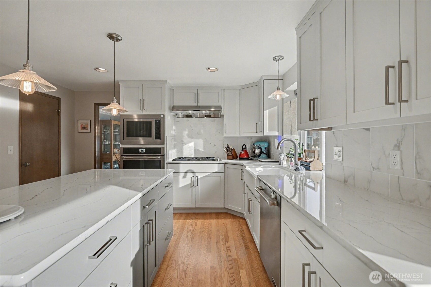 15823 Southeast 182nd Place Renton, WA 98058 - Photo 13 of 30 a kitchen with granite countertop a sink stove and refrigerator