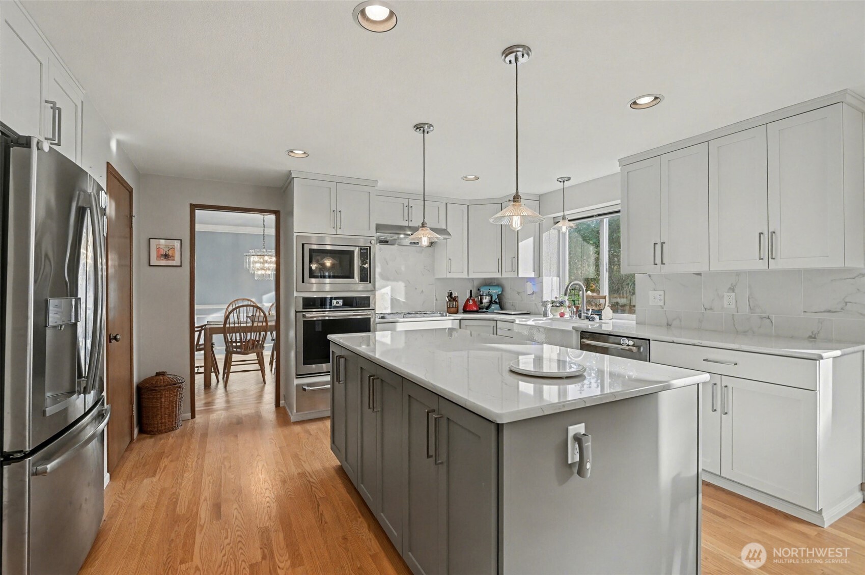 15823 Southeast 182nd Place Renton, WA 98058 - Photo 14 of 30 a kitchen with stainless steel appliances granite countertop a sink stove and refrigerator