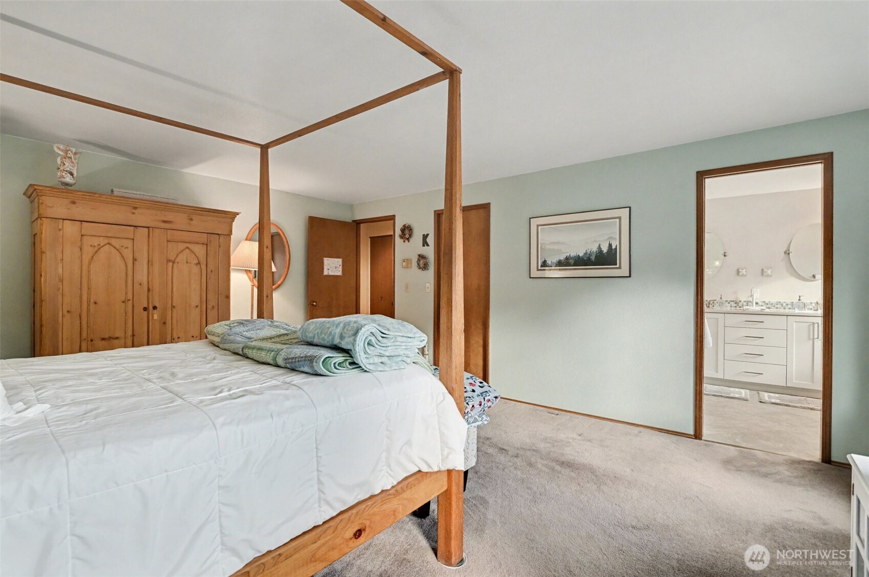 15823 Southeast 182nd Place Renton, WA 98058 - Photo 18 of 30 a bedroom with a bed and cabinets