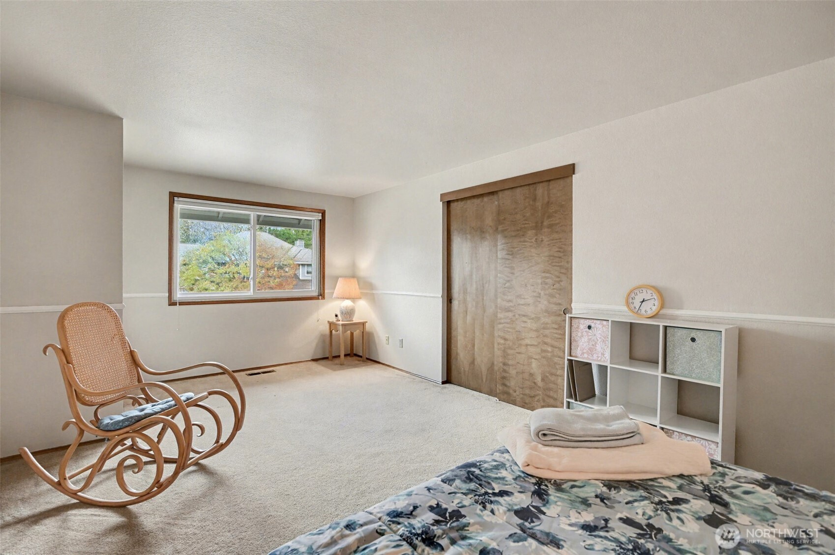 15823 Southeast 182nd Place Renton, WA 98058 - Photo 22 of 30 a bedroom with a bed and chair