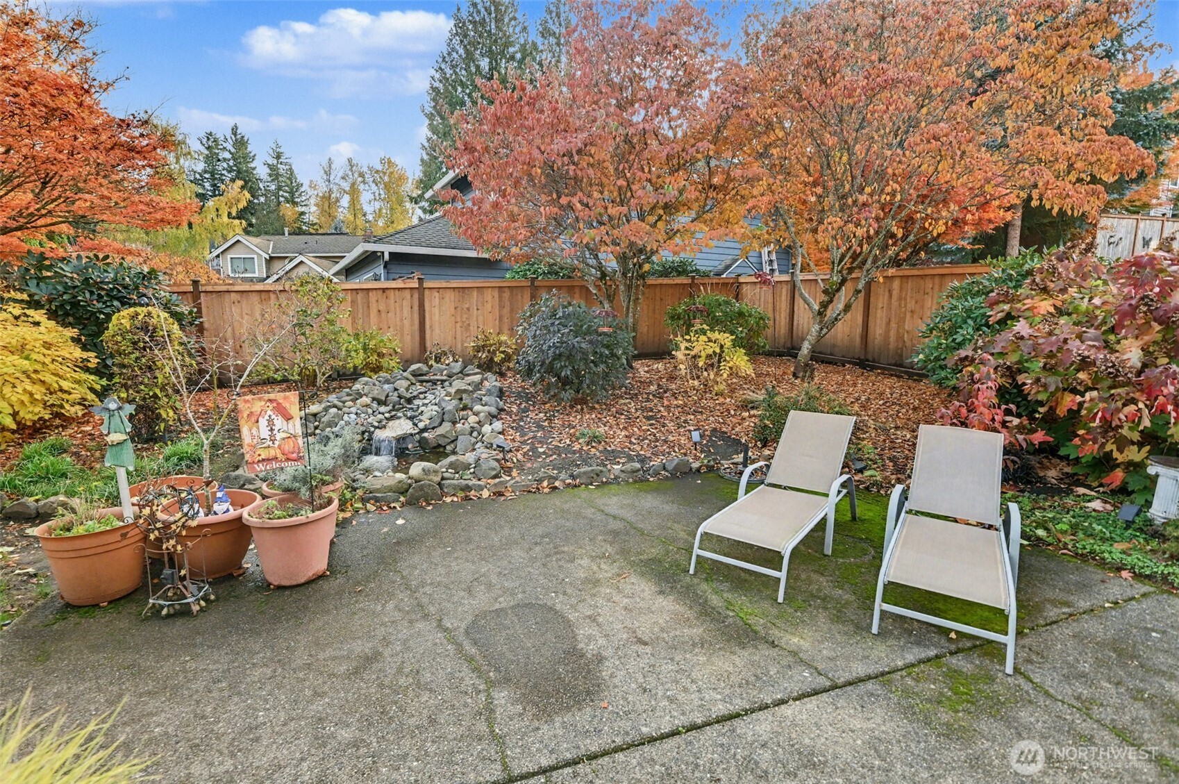 15823 Southeast 182nd Place Renton, WA 98058 - Photo 30 of 30 a view of a chairs and table in the backyard
