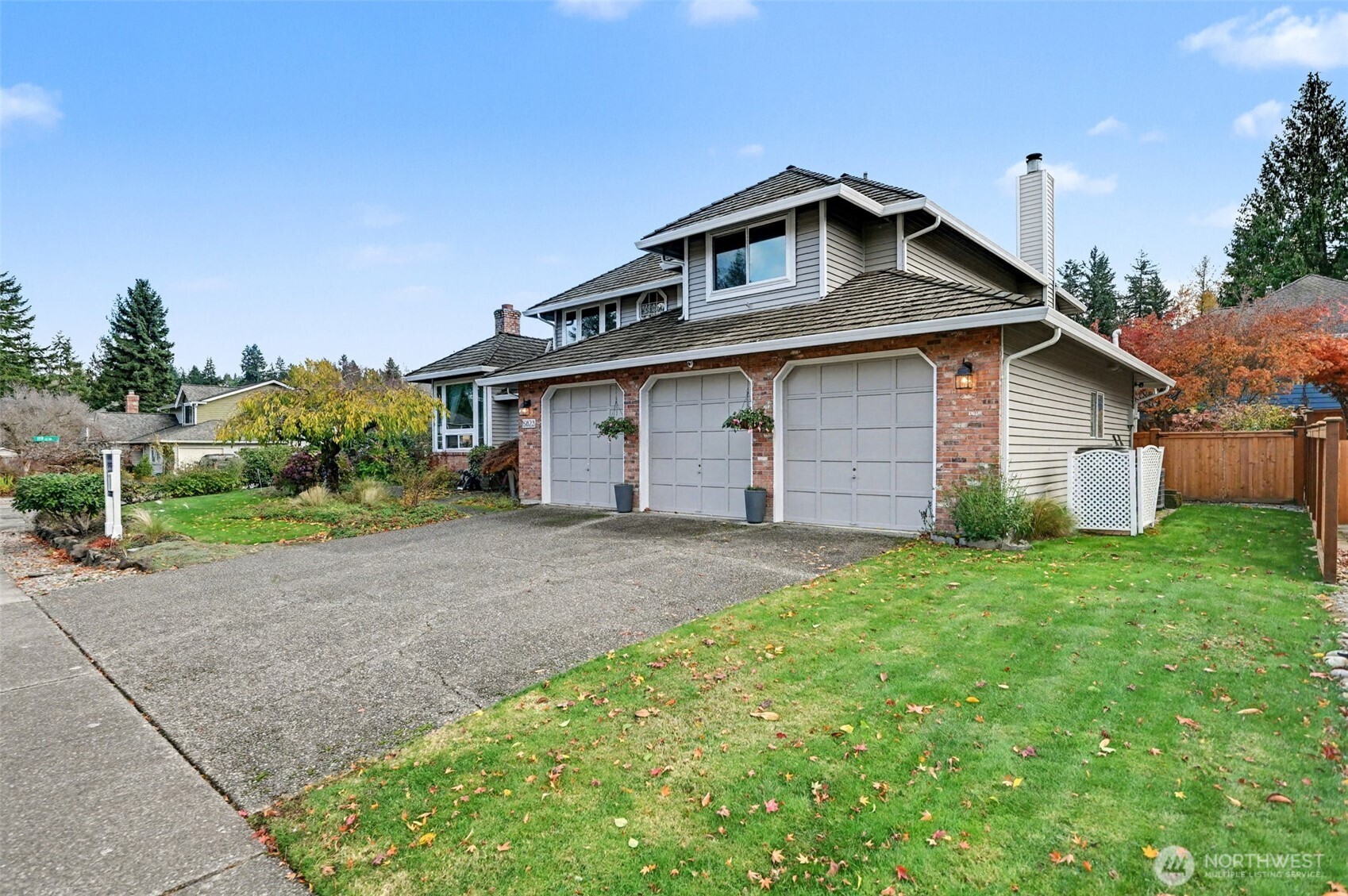 15823 Southeast 182nd Place Renton, WA 98058 - Photo 4 of 30 a front view of a house with a yard and garage