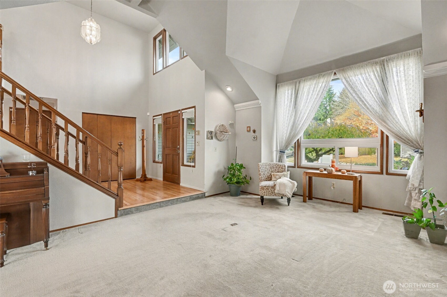 15823 Southeast 182nd Place Renton, WA 98058 - Photo 7 of 30 a living room with furniture and a large window