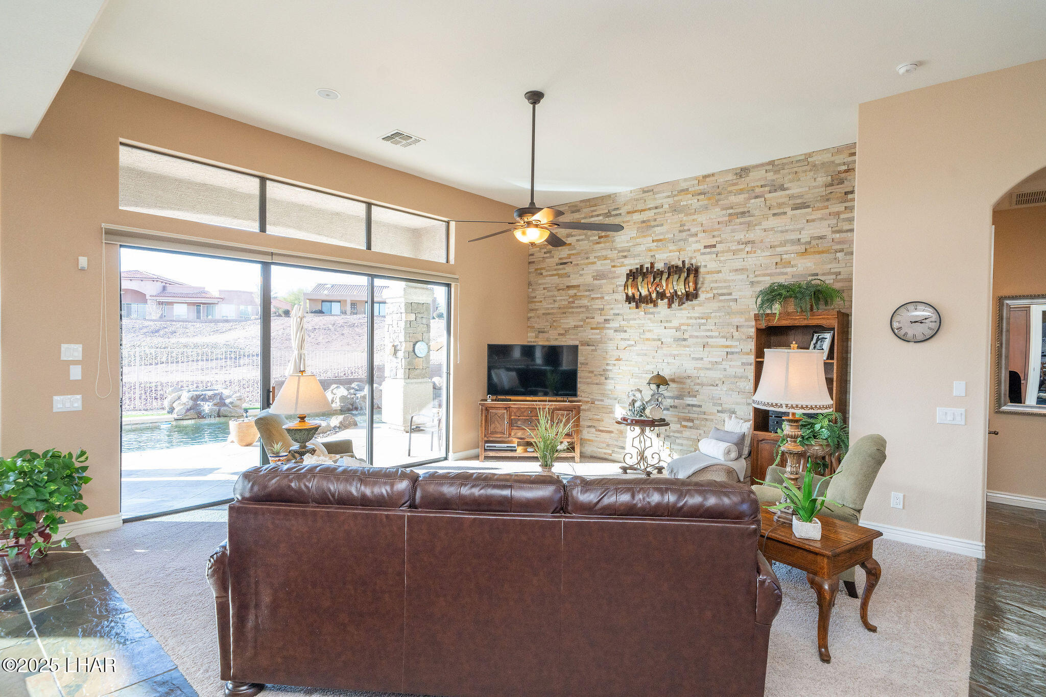 3553 North Swilican Bridge Road Lake Havasu City, AZ 86404 - Photo 11 of 104 a living room with furniture and a flat screen tv