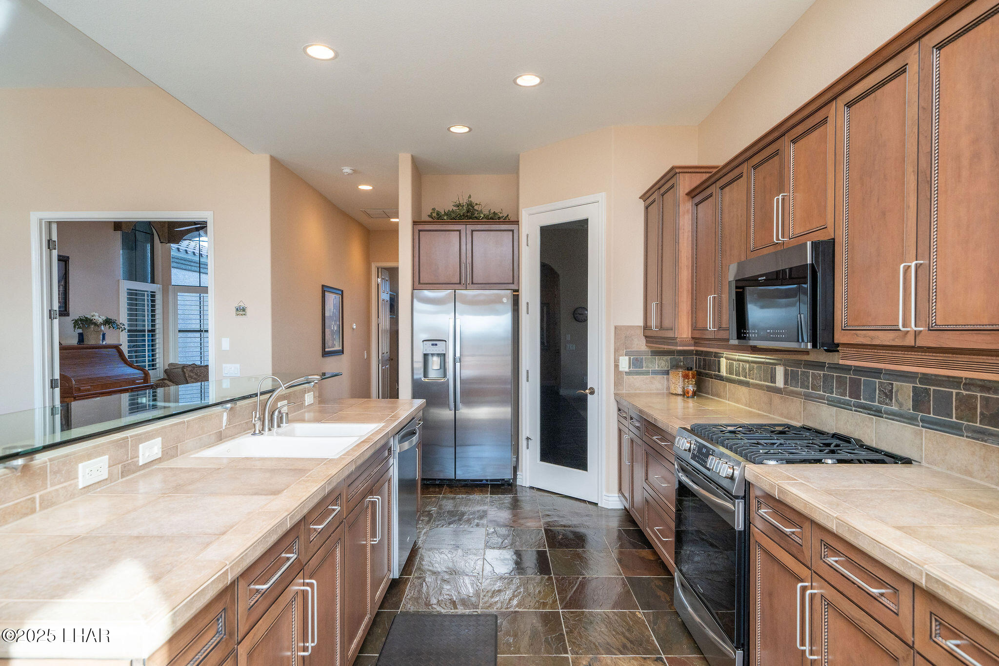 3553 North Swilican Bridge Road Lake Havasu City, AZ 86404 - Photo 15 of 104 a large kitchen with stainless steel appliances granite countertop a lot of counter space and a sink