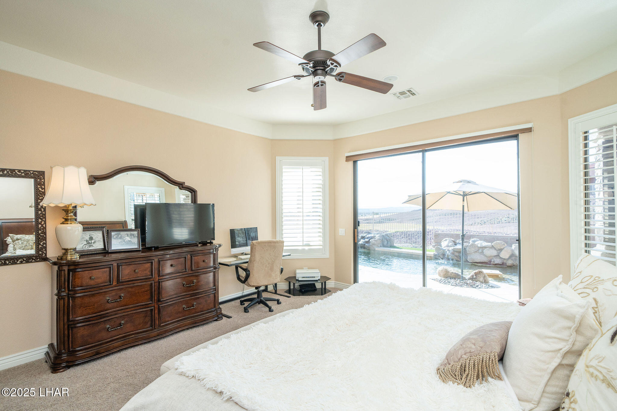 3553 North Swilican Bridge Road Lake Havasu City, AZ 86404 - Photo 28 of 104 a bed room with a bed and a chandelier