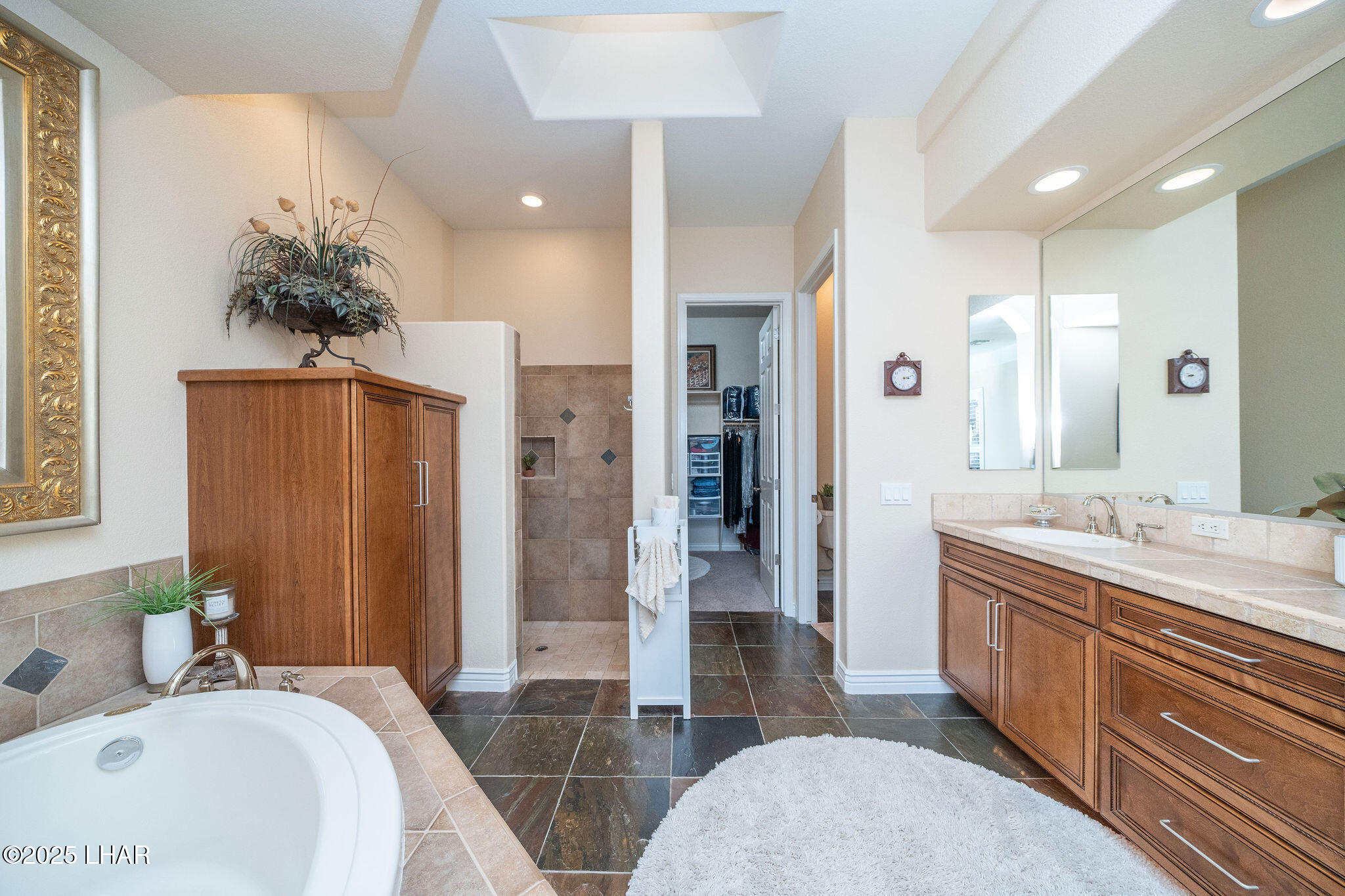 3553 North Swilican Bridge Road Lake Havasu City, AZ 86404 - Photo 31 of 104 a spacious bathroom with a sink a large mirror and a shower