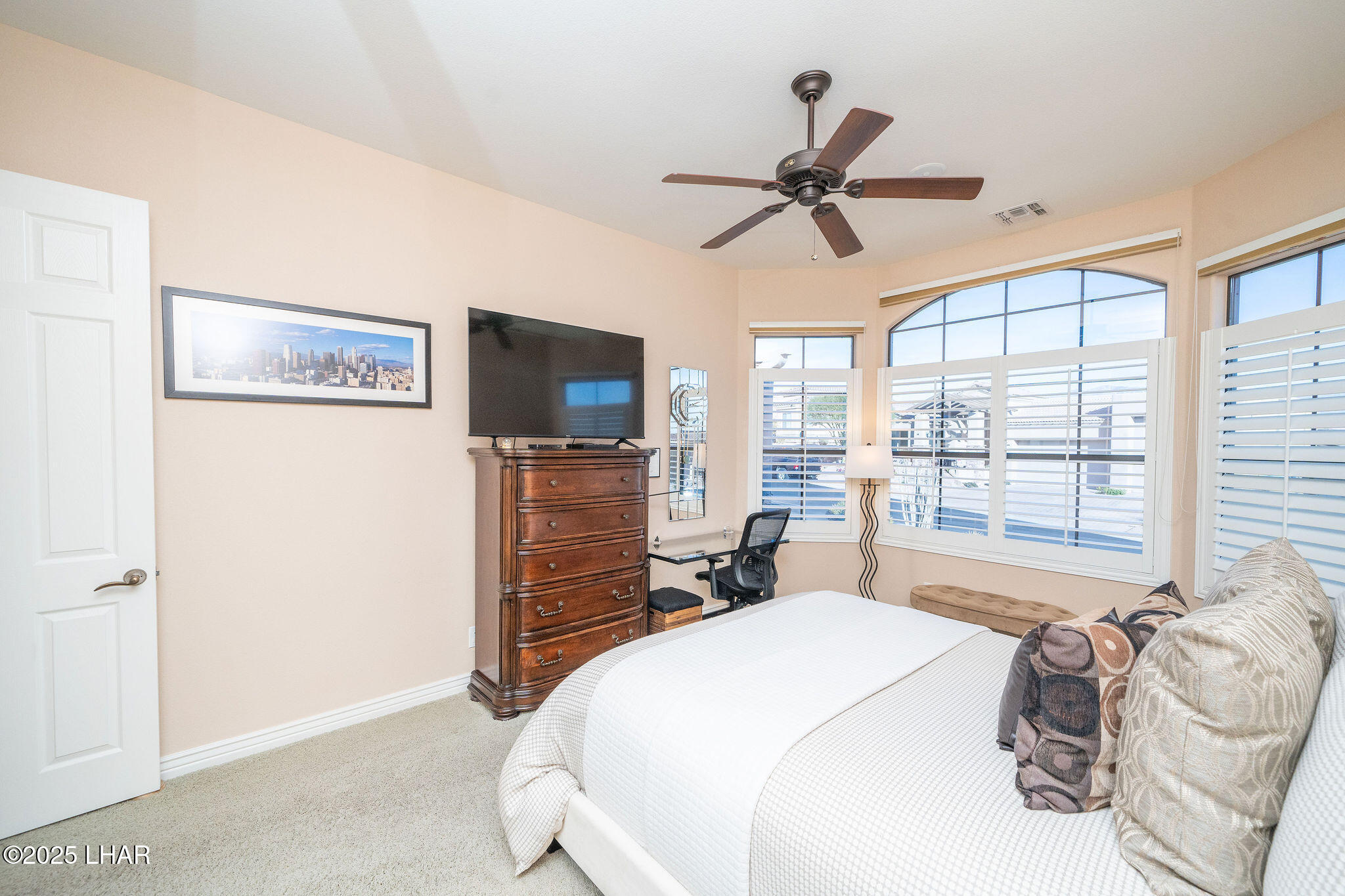 3553 North Swilican Bridge Road Lake Havasu City, AZ 86404 - Photo 37 of 104 a bedroom with a bed and a flat screen tv