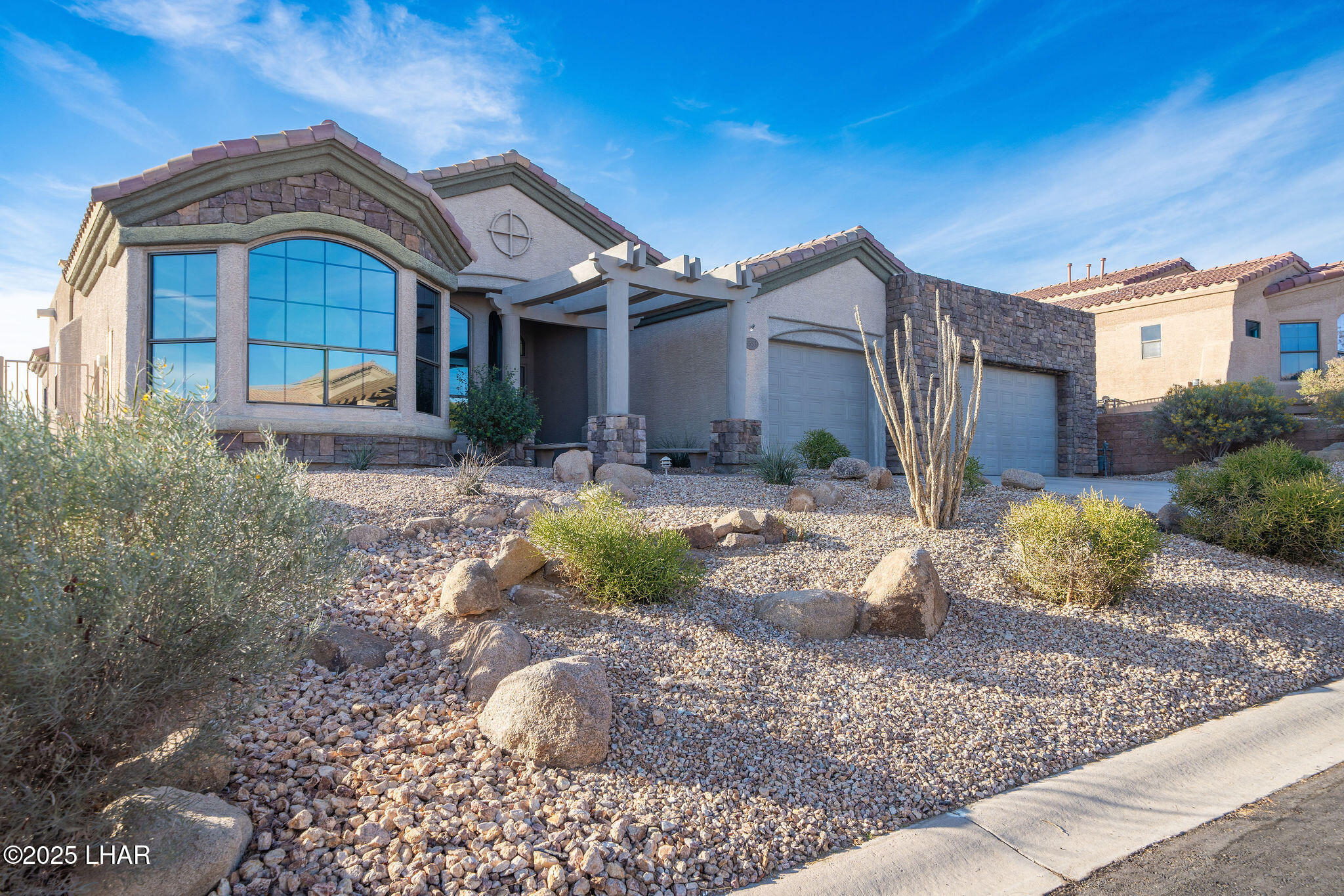 3553 North Swilican Bridge Road Lake Havasu City, AZ 86404 - Photo 5 of 104 a front view of a house with a yard