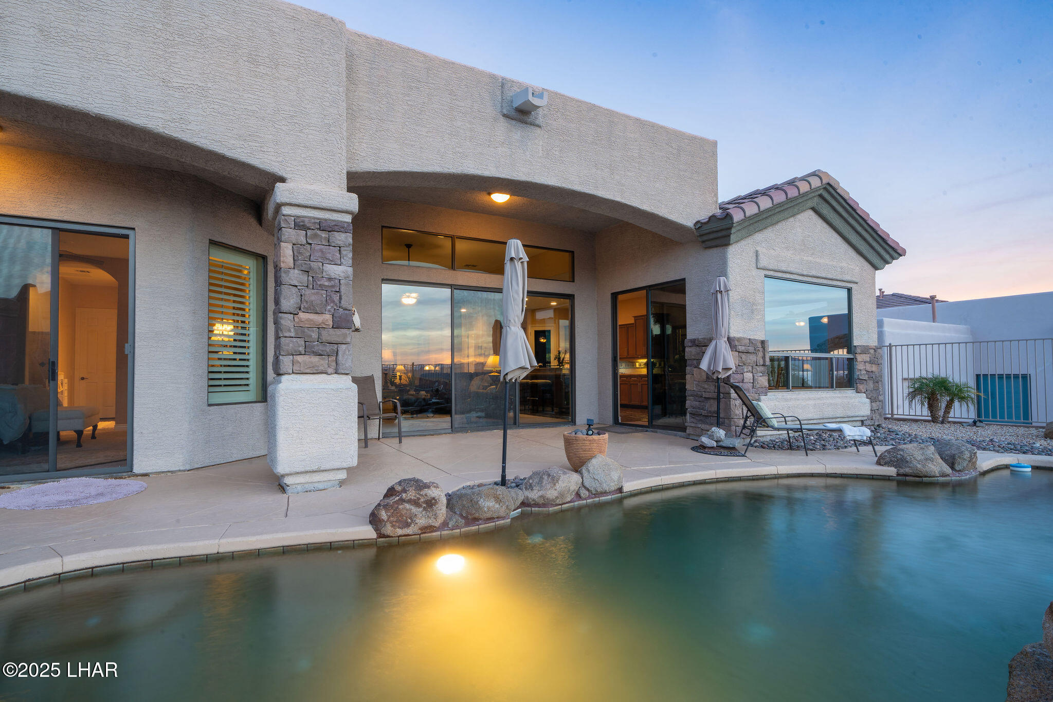 3553 North Swilican Bridge Road Lake Havasu City, AZ 86404 - Photo 58 of 104 a view of a patio with swimming pool table and chairs
