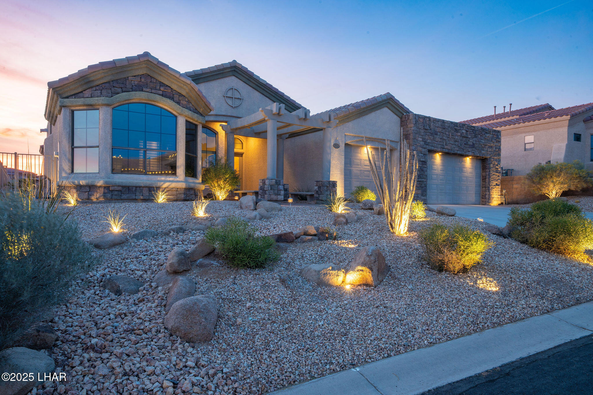 3553 North Swilican Bridge Road Lake Havasu City, AZ 86404 - Photo 66 of 104 a view of a house with a yard and a fire pit
