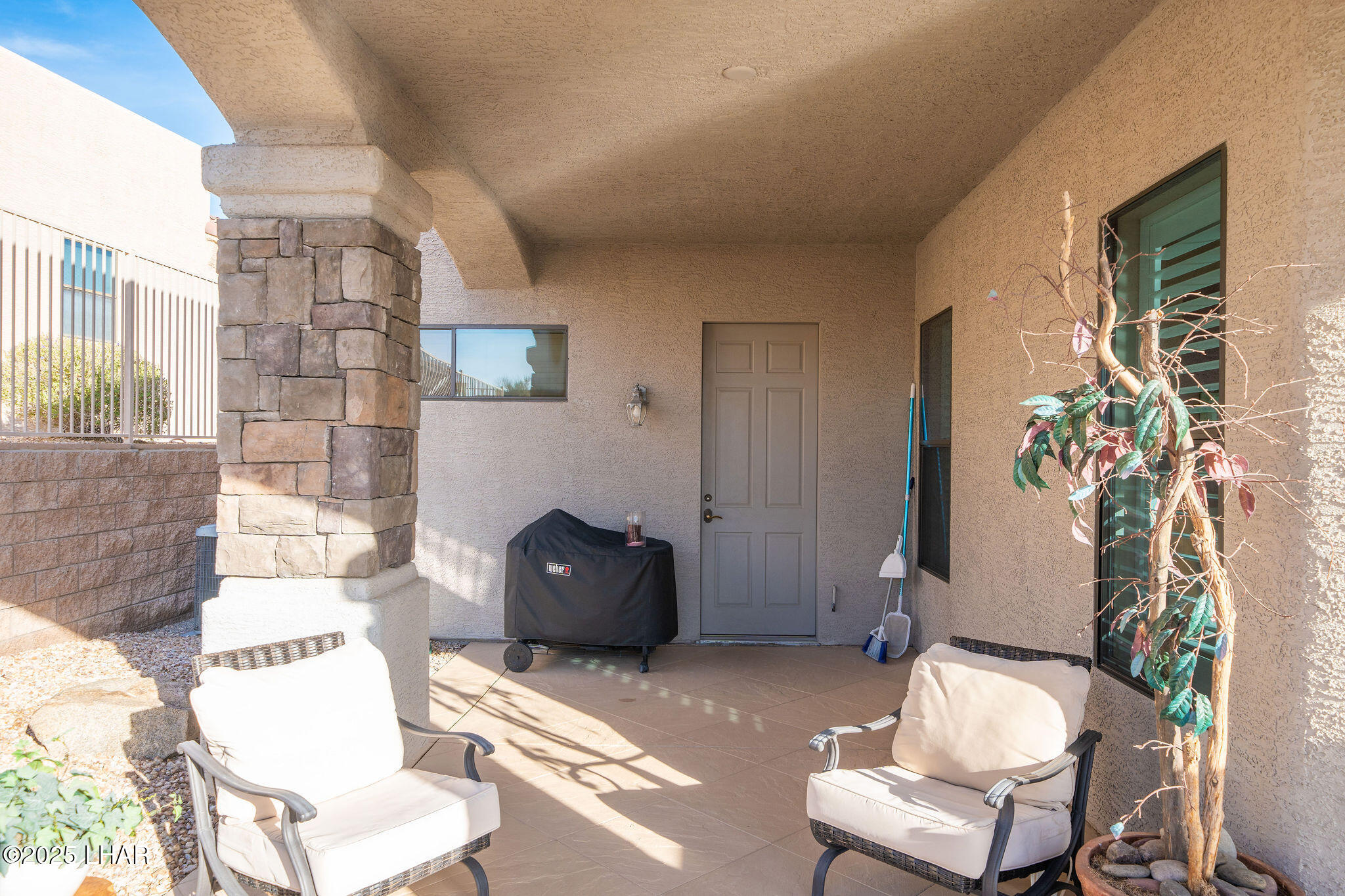 3553 North Swilican Bridge Road Lake Havasu City, AZ 86404 - Photo 70 of 104 a living room with furniture and a potted plant