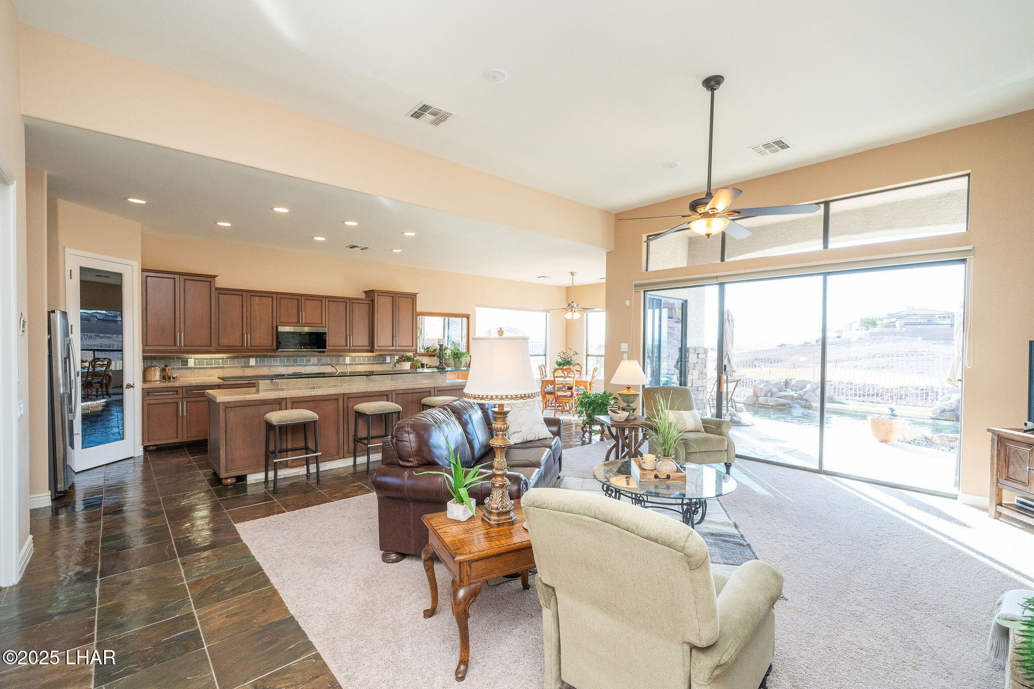 3553 North Swilican Bridge Road Lake Havasu City, AZ 86404 - Photo 7 of 104 a living room with lots of furniture and kitchen view
