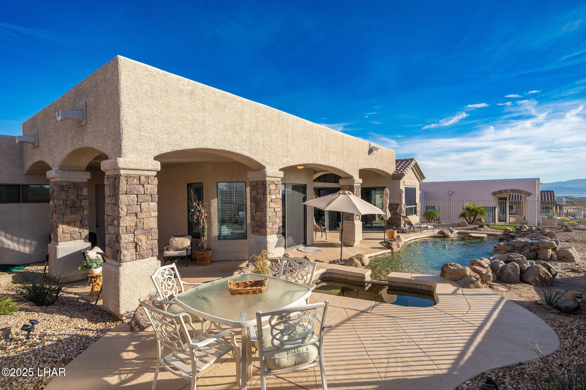 3553 North Swilican Bridge Road Lake Havasu City, AZ 86404 - Photo 72 of 104 a view of a dinning table and chairs in the patio