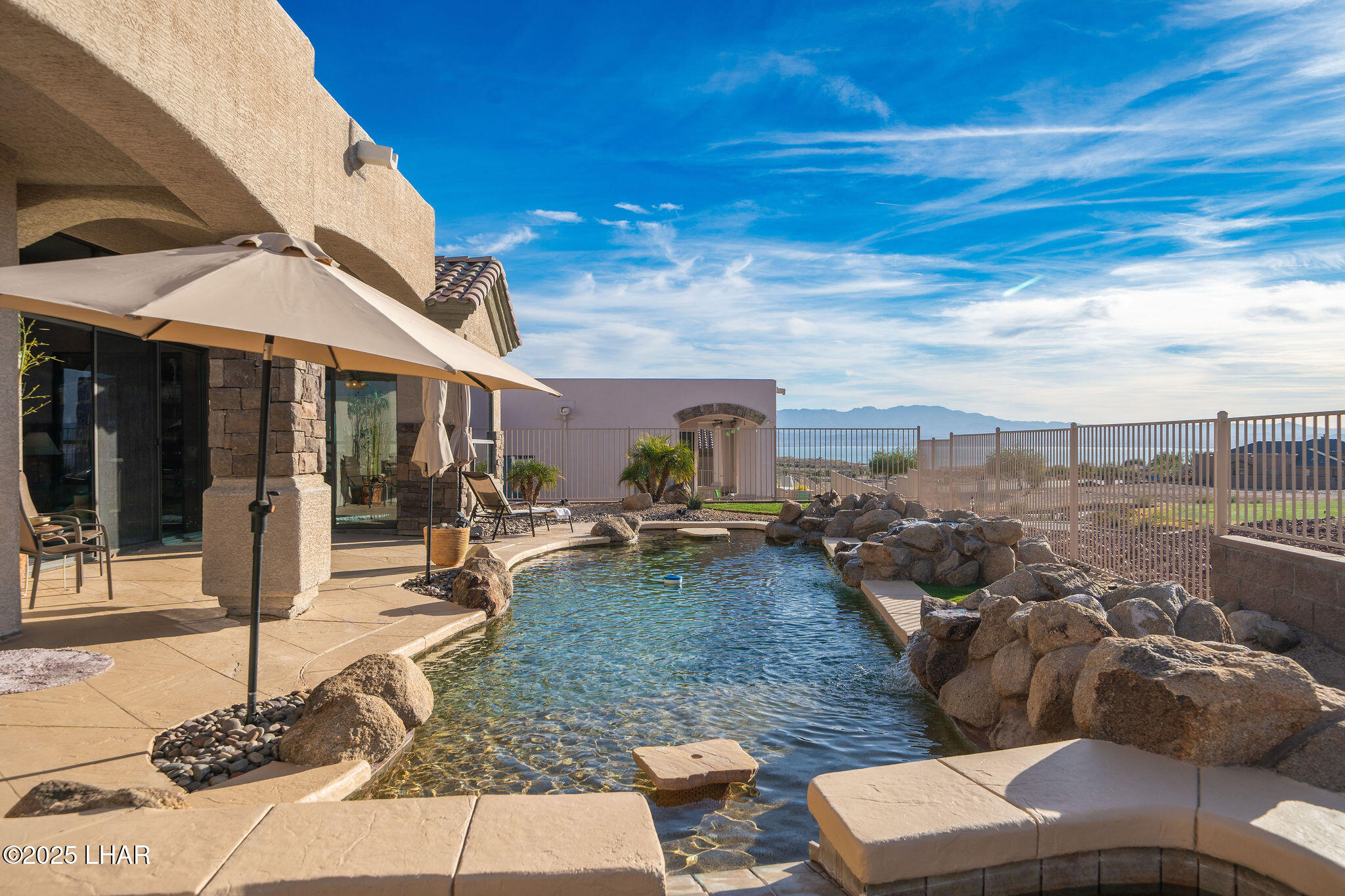 3553 North Swilican Bridge Road Lake Havasu City, AZ 86404 - Photo 75 of 104 a view of a patio with couches and table and chairs and potted plants