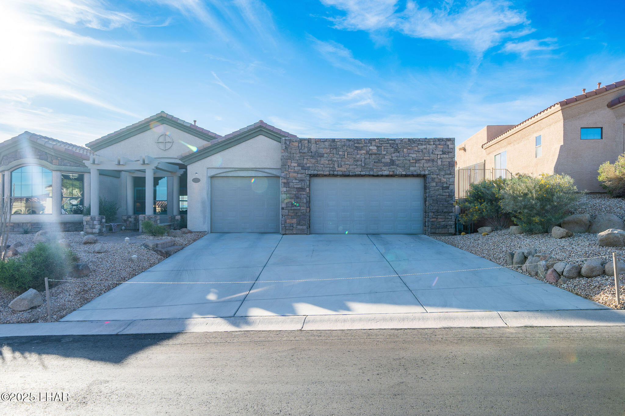 3553 North Swilican Bridge Road Lake Havasu City, AZ 86404 - Photo 84 of 104 a front view of a house with a yard and garage