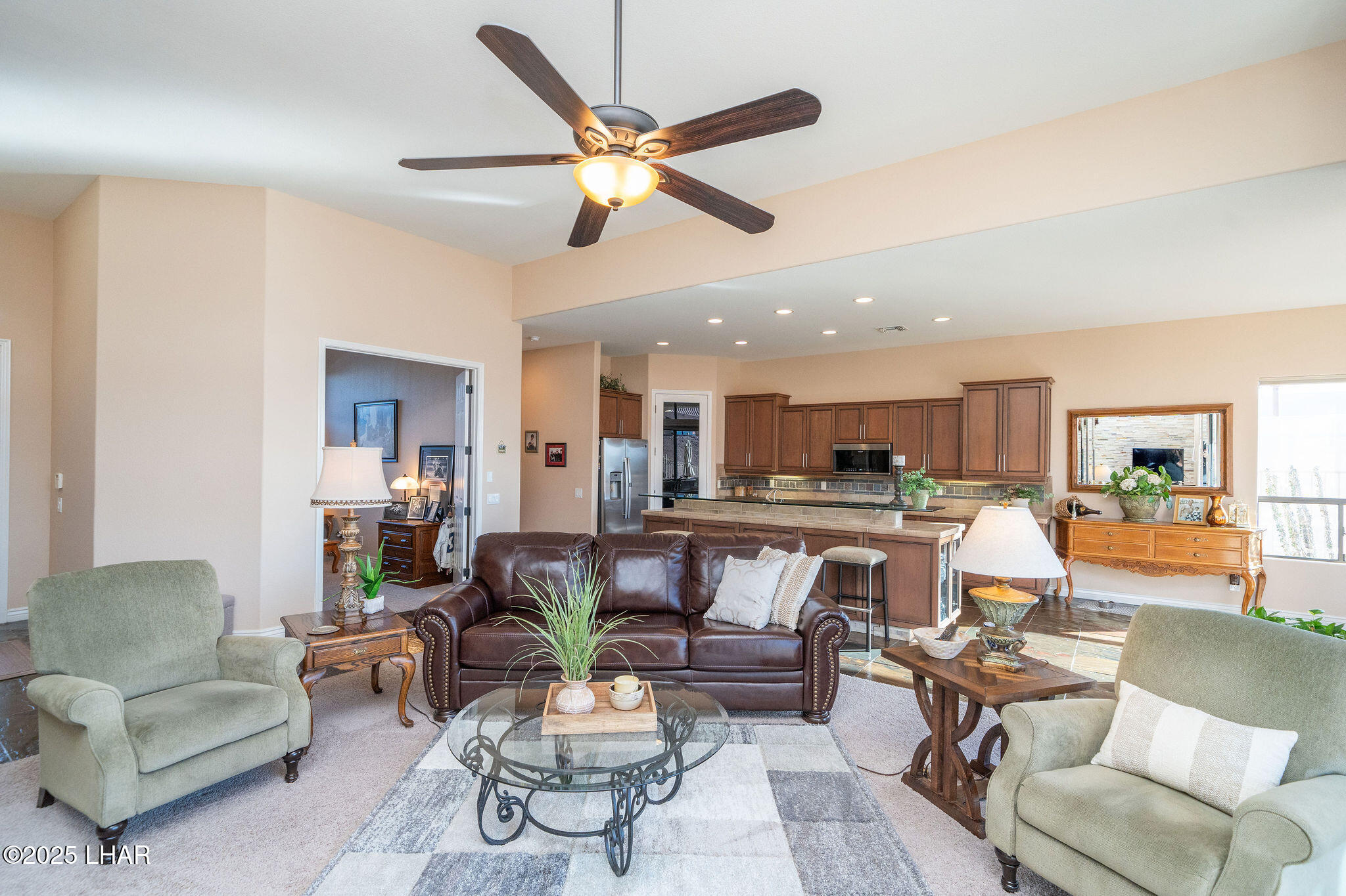 3553 North Swilican Bridge Road Lake Havasu City, AZ 86404 - Photo 9 of 104 a living room with furniture kitchen view and a chandelier