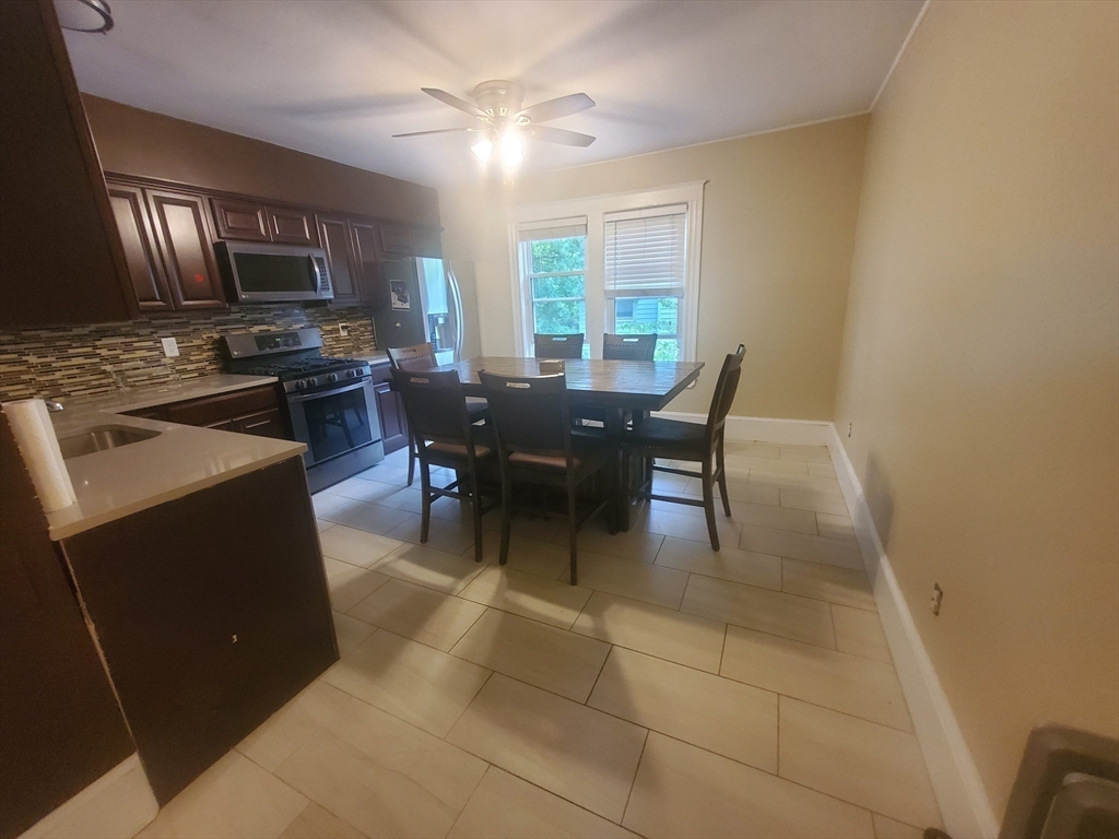 45 Intervale Street, Unit 2 Boston, MA 02121 - Photo 3 of 17 a view of a dining room with furniture and chandelier
