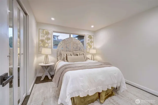 a bed room with a bed and a window