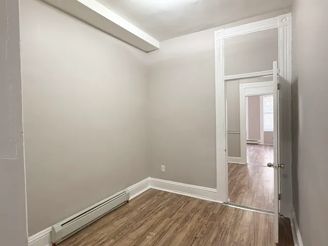 a view of small space with wooden floor