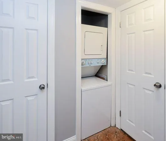 a view of hallway with washer and dryer