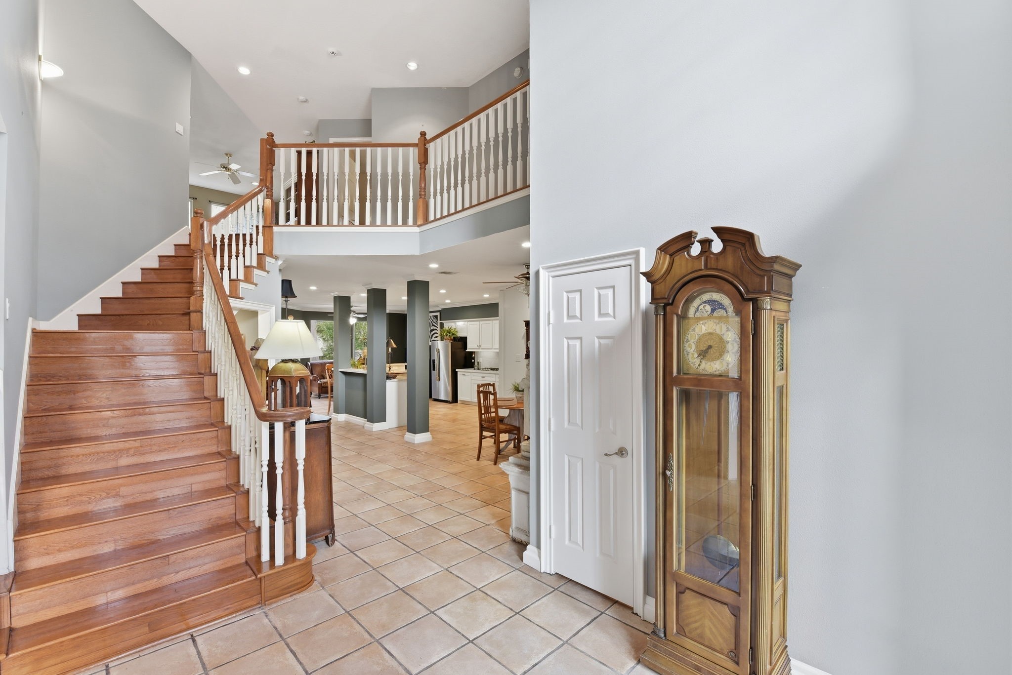16322 Cranwood Drive Spring, TX 77379 - Photo 9 of 42 Ascend the elegant hardwood staircase to discover a spacious game room and two additional inviting bedrooms, perfect for relaxation and entertainment.