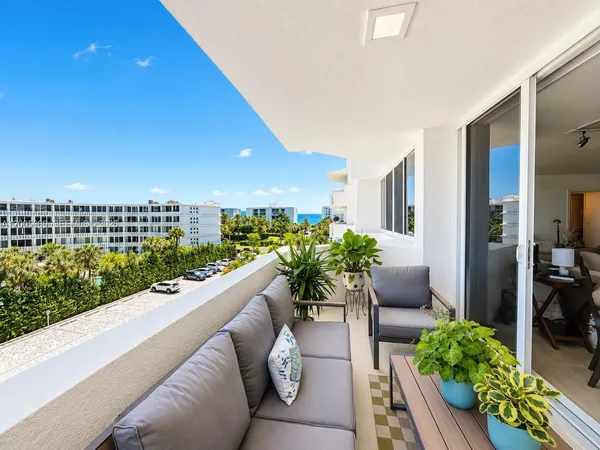 a view of balcony with furniture