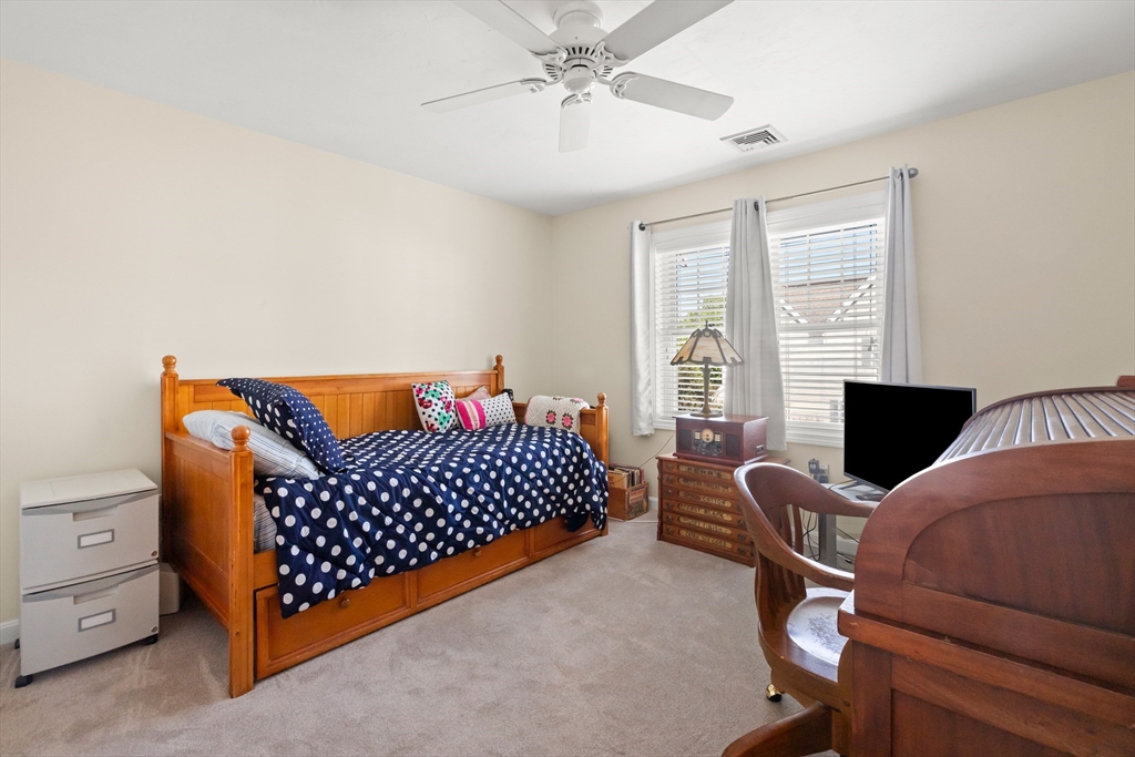 35 Collins Street, Unit 87 Danvers, MA 01923 - Photo 16 of 28 a bedroom with furniture and window