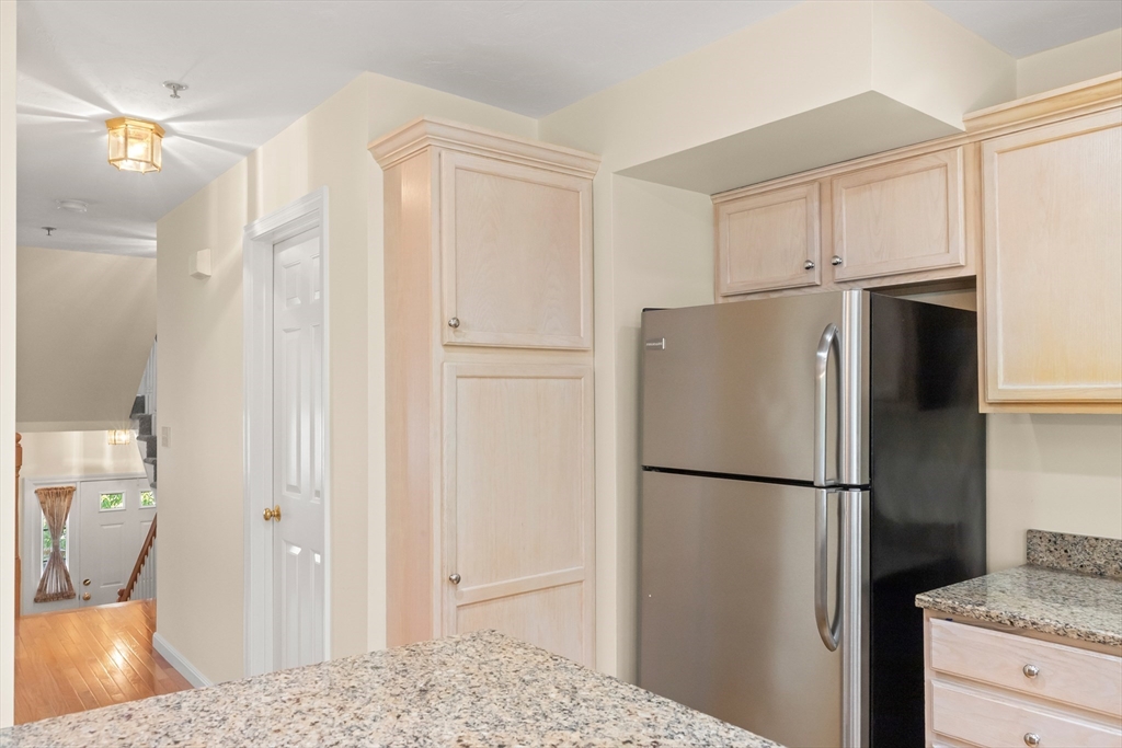 35 Collins Street, Unit 87 Danvers, MA 01923 - Photo 5 of 28 a refrigerator freezer sitting in a kitchen
