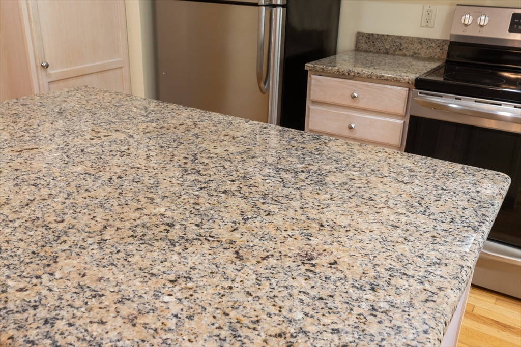 35 Collins Street, Unit 87 Danvers, MA 01923 - Photo 7 of 28 a kitchen with a sink and cabinets