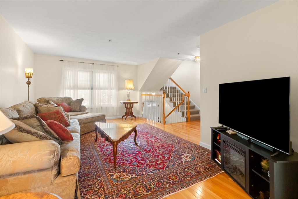 35 Collins Street, Unit 87 Danvers, MA 01923 - Photo 8 of 28 a living room with furniture and a flat screen tv