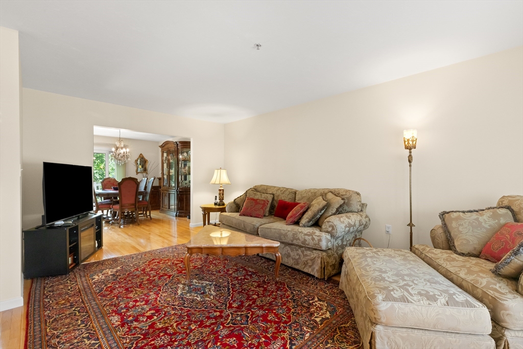 35 Collins Street, Unit 87 Danvers, MA 01923 - Photo 9 of 28 a living room with furniture and a flat screen tv