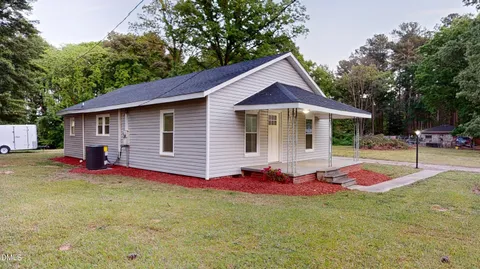 a front view of a house with yard