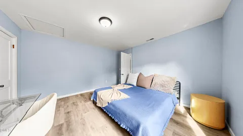 a bedroom with a bed and couch