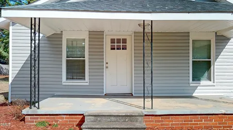 a front view of a house with stairs