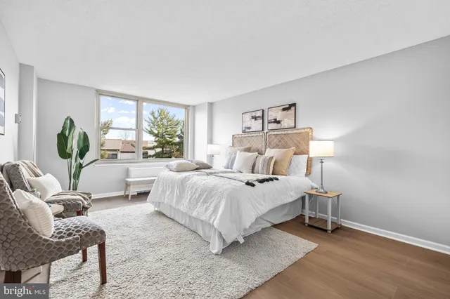 a bedroom with a bed and a couch