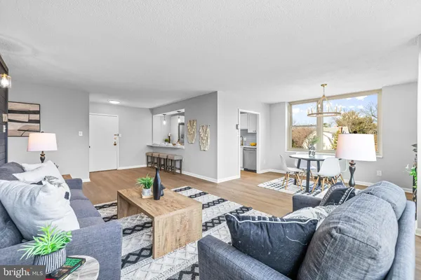 a living room with furniture and a table