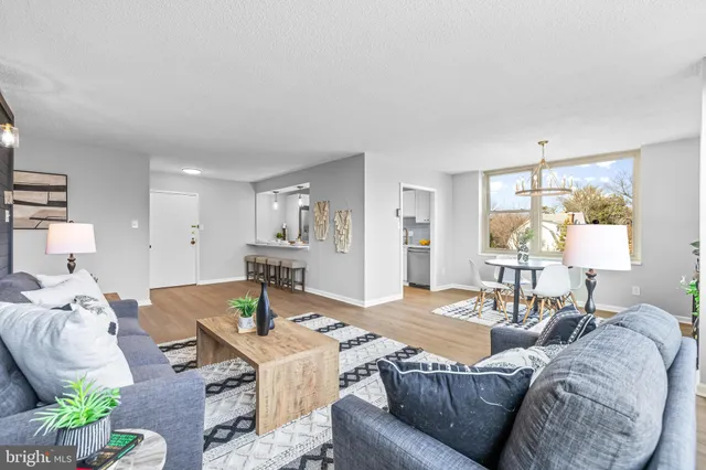 a living room with furniture and a table