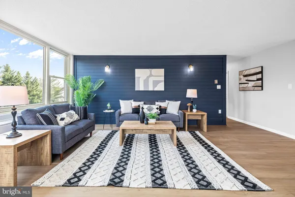 a living room with furniture and a rug