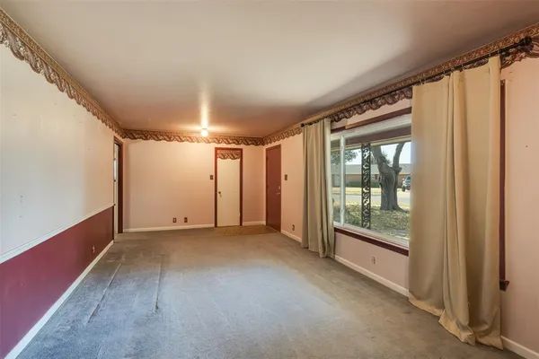 a view of a room with large windows