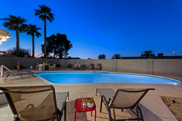 a view of a chairs and table in the patio