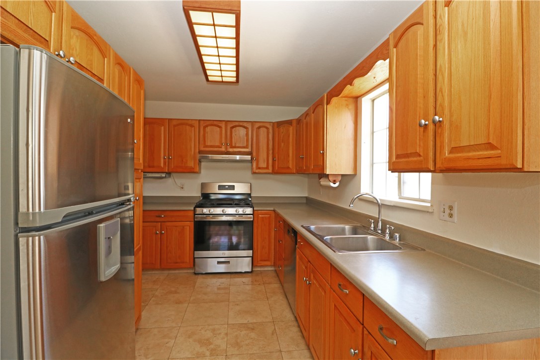 721 North Milford Road Orange, CA 92867 - Photo 13 of 38 Kitchen with plenty of cabinetry and stainless steel appliances.