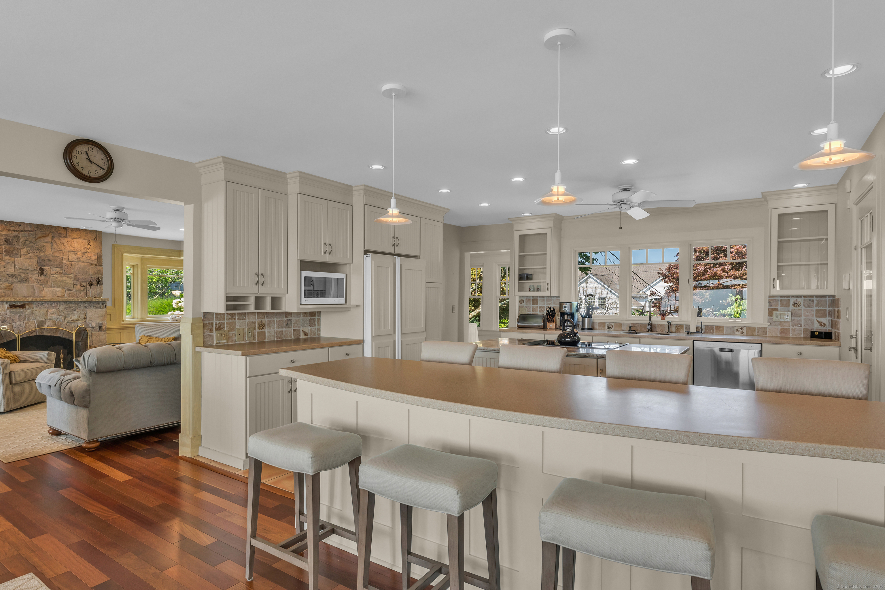 55 Shore Road Clinton, CT 06413 - Photo 12 of 33 a large kitchen with lots of counter space and furniture